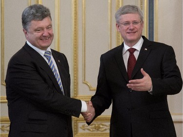 Ukranian President Petro Poroshenko meets with Canadian Prime Minister Stephen Harper several hours after Poroshenko was sworn in, Saturday June 7, 2014, in Kyiv, Ukraine.