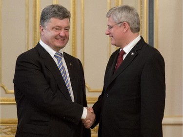 Ukranian President Petro Poroshenko meets with Canadian Prime Minister Stephen Harper several hours after Poroshenko was sworn in, Saturday June 7, 2014 in Kyiv, Ukraine.