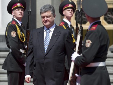 Ukranian President Petro Poroshenko leaves parliament after being sworn in during his inauguration ceremony Saturday, June 7, 2014 in Kyiv, Ukraine.