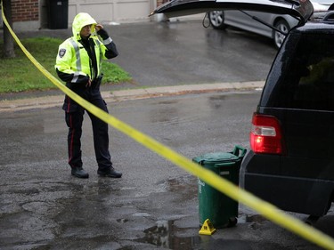 Police investigate a shooting in the 2800 block of Cedarwood Dr. near the Herongate Mall in Ottawa, Tuesday, June 17, 2014. One man is in hospital after being shot. Police say they are looking for a suspect. A pistol was recovered in a green bin near the scene. Mike Carroccetto / Ottawa Citizen