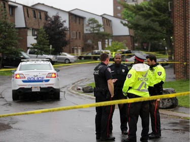 Police investigate a shooting in the 2800 block of Cedarwood Dr. near the Herongate Mall in Ottawa, Tuesday, June 17, 2014. One man is in hospital after being shot. Police say they are looking for a suspect. A pistol was recovered near the scene. Mike Carroccetto / Ottawa Citizen