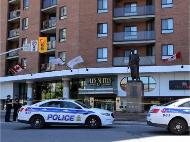 SATURDAY: Police officers at the scene of fatal stabbing in front of Les Suite Hotel on Besserer Street on Saturday, June 7, 2014.