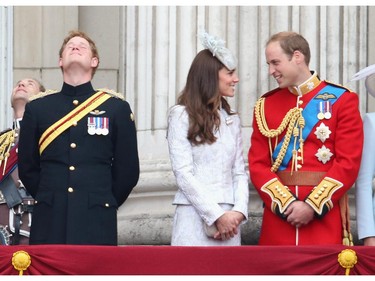 Prince Harry, Catherine, Duchess of Cambridge and Prince William, Duke of Cambridge stand on the balcony during during Trooping the Colour - Queen Elizabeth II's Birthday Parade, at The Royal Horseguards on June 14, 2014 in London, England.