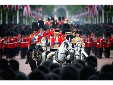Queen Elizabeth II and Prince Philip, Duke of Edinburgh process down the Mall during Trooping the Colour - Queen Elizabeth II's Birthday Parade, at The Royal Horseguards on June 14, 2014 in London, England.