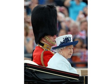 Queen Elizabeth II and Prince Philip, Duke of Edinburgh travel by carriage during Trooping the Colour - Queen Elizabeth II's Birthday Parade, at The Royal Horseguards on June 14, 2014 in London, England.