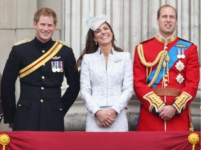Prince Harry, Catherine, Duchess of Cambridge and Prince William, Duke of Cambridge on the balcony during Trooping the Colour - Queen Elizabeth II's Birthday Parade, at The Royal Horseguards on June 14, 2014 in London, England.