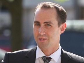 Defendant Michael Sona walks to the courthouse in Guelph, ON, Wednesday, June 4, 2014, the the Robocalls trial.