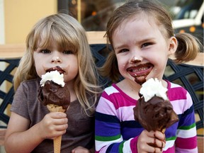 Sarah Wueppelmann and Maeve House, both 3-1/2, enjoy a gelato cone outside Stella Luna on Bank Street.