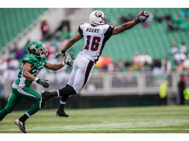 REGINA, SK - JUNE 14: Marcus Henry #16 of the Ottawa RedBlacks reaches for a pass during pre-season week B of the 2014 CFL season in a game between the Ottawa RedBlacks and Saskatchewan Roughriders at Mosaic Stadium on June 14, 2014 in Regina, Saskatchewan, Canada.