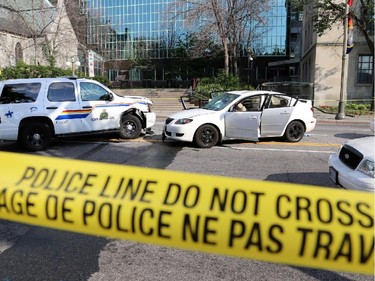Several people are in hospital -- one with seriously injuries -- after an RCMP SUV and a Mazda collided in front of the Supreme court building on Wellington St. in Ottawa, Sunday, June 29, 2014. Some media reports say that the Mazda was stolen, and police may have been chasing the vehicle. Mike Carroccetto / Ottawa Citizen