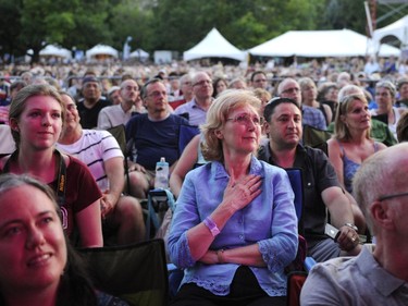 Spectators take in Aretha Franklin's performance on the Main Stage at Confederation Park during the Ottawa Jazz Festival in Ottawa on Saturday, June 28, 2014.