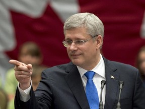 Prime Minister Stephen Harper takes a question as he attends an event at the Confederation Centre of the Arts, in Charlottetown, on Thursday, June 19, 2014. Harper's visit is part of the 150th anniversary of the Charlottetown Conference and its role in the building of Canada. THE CANADIAN PRESS/Andrew Vaughan