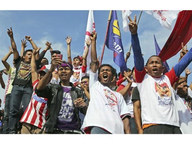 Supporters of Indonesian presidential candidate Joko Widodo, popularly known as 'Jokowi,' shout slogans during his campaign rally in Cilacap, Central Java, Indonesia, Friday, June 13, 2014. Indonesia will hold its presidential poll on July 9.