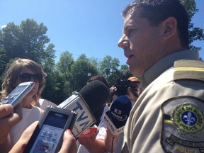 Sûreté du Québec Sgt. Marc Tessier speaks with media on Friday after the suicide by shooting by a MRC des Collines-de-l'Outaouais officer inside the Wakefield police station.