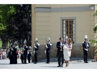 Princess Madeleine of Sweden (R) and her husband Christopher O'Neill hold their daughter, Princess Leonore on June 8, 2014 after her christening at the Royal Chapel in Drottningholms royal palace near Stockholm.