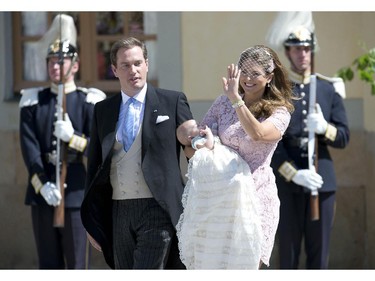 Princess Madeleine of Sweden (R) and her husband Christopher O'Neill hold their daughter, Princess Leonore on June 8, 2014 after her christening at the Royal Chapel in Drottningholms royal palace near Stockholm.