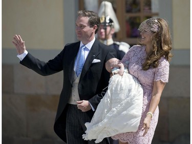 Princess Madeleine of Sweden (R) and her husband Christopher O'Neill hold their daughter, Princess Leonore on June 8, 2014 after her christening at the Royal Chapel in Drottningholms royal palace near Stockholm.