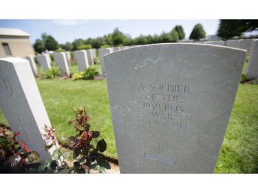 BAYEUX, FRANCE - JUNE 06:  A headstone is seen at Bayeux Cemetery during D-Day 70 Commemorations on June 6, 2014 in Bayeux, France. Friday 6th June is the 70th anniversary of the D-Day landings which saw 156,000 troops from the allied countries including the United Kingdom and the United States join forces to launch an audacious attack on the beaches of Normandy, these assaults are credited with the eventual defeat of Nazi Germany. A series of events commemorating the 70th anniversary are planned for the week with many heads of state travelling to the famous beaches to pay their respects to those who lost their lives