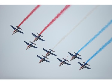 OUISTREHAM, FRANCE - JUNE 06:  French planes trailing red, white and blue pass over the main international ceremony commemorating the 70th anniversary of the D-Day invasion with 17 heads of state at Sword Beach on June 6, 2014 at Ouistreham, France. Friday the 6th of June is the 70th anniversary of the D-Day landings that saw 156,000 troops from the Allied countries, including the United Kingdom and the United States, join forces to launch an audacious attack on the beaches of Normandy,  these assaults are credited with the eventual defeat of Nazi Germany. A series of events commemorating the 70th anniversary are planned for the week with many heads of state travelling to the famous beaches to pay their respects to those who lost their lives.