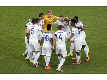 The English team huddle prior to the group D World Cup soccer match between England and Italy in the Arena da Amazonia in Manaus, Brazil, Saturday, June 14, 2014.
