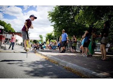 The Hintonburg Happening is a nine day art, music, fashion and food festival that kicked off Saturday June 21, 2014 at Somerset Square. Nine year old Peter Nelles doesn't let an arm in a sling stop him from bouncing around on a pogo stick Saturday afternoon.