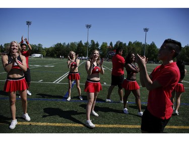 The Ottawa RedBlacks cheerleaders perform during an intrasquad game at the Mont-Bleu Sports Complex in Gatineau on Saturday, June 7, 2014.