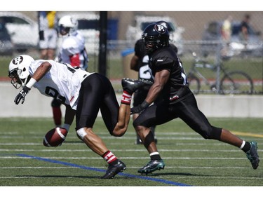 The Ottawa RedBlacks' Paris Jackson is tackled after a catch during an intrasquad game at the Mont-Bleu Sports Complex in Gatineau on Saturday, June 7, 2014.