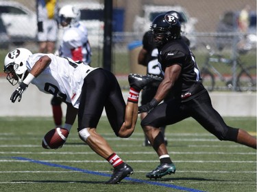 The Ottawa RedBlacks' Paris Jackson is tackled after a catch during an intrasquad game at the Mont-Bleu Sports Complex in Gatineau on Saturday, June 7, 2014.