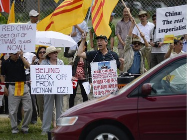 The Vietnamese community members from Ottawa, Toronto and Montreal gather to protest in front of Chinese Embassy on Sunday, June 8, 2014. The Vietnamese community members are protesting against the Chinese government's aggressive territorial policy toward Vietnam, and against the weak response as well as the suppression of patriotic demonstrations by Vietnamese citizens on the part of the Vietnamese government. (James Park / Ottawa Citizen)