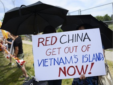 The Vietnamese community members from Ottawa, Toronto and Montreal gather to protest in front of Chinese Embassy on Sunday, June 8, 2014. The Vietnamese community members are protesting against the Chinese government's aggressive territorial policy toward Vietnam, and against the weak response as well as the suppression of patriotic demonstrations by Vietnamese citizens on the part of the Vietnamese government. (James Park / Ottawa Citizen)