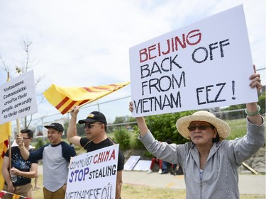 The Vietnamese community members from Ottawa, Toronto and Montreal gather to protest in front of Chinese Embassy on Sunday, June 8, 2014. The Vietnamese community members are protesting against the Chinese government's aggressive territorial policy toward Vietnam, and against the weak response as well as the suppression of patriotic demonstrations by Vietnamese citizens on the part of the Vietnamese government. (James Park / Ottawa Citizen)