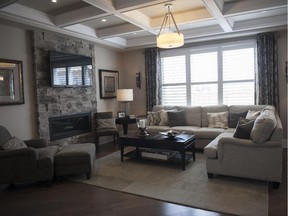 Upgrades such as a coffered ceiling and stone fireplace surround in the Parkside show off some of the design options.