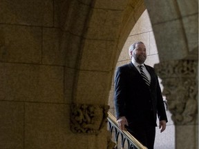 NDP leader Tom Mulcair makes his way to news conference in the Foyer of the House of Commons Monday May 12, 2014.