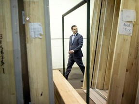 Ontario PC leader Tim Hudak leaves a campaign rally at a windows manufacturer in Mississauga, Ont. on Wednesday June 11, 2014, as he continues his election campaign.