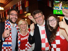 To mark Croatia's National Day and World Cup Inaugural Match between  Croatia and Brazil, Ambassador Veselko Grubisic and his family celebrated at the Earl of Sussex Pub. From left, Matthew, Martha, Veselko and Ana Maria Grubisic.
