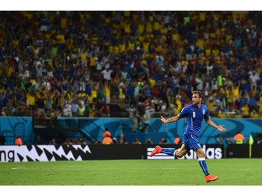 Italy's midfielder Claudio Marchisio celebrates after scoring during a Group D football match between England and Italy at the Amazonia Arena in Manaus during the 2014 FIFA World Cup on June 14, 2014.