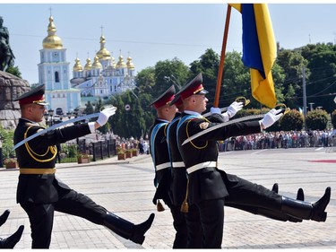 Ukrainian soldiers of the guard of honour march during Ukraine's new President Petro Poroshenko inauguration ceremony in Kiev on June 7, 2014. Poroshenko was sworn in as Ukraine's fifth post-Soviet president today, vowing to maintain the unity of his country amid a continuing crisis with Russia. Poroshenko, a 48-year-old billionaire who won the presidential election on May 25 with 54.7 percent of the vote, took the oath in the Ukrainian parliament in Kiev.