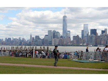 Security patrols on Liberty Island June 6, 2014 in New York, as people gathered  to participate in ceremonies commemorating the WWII 70th anniversary of D-Day.