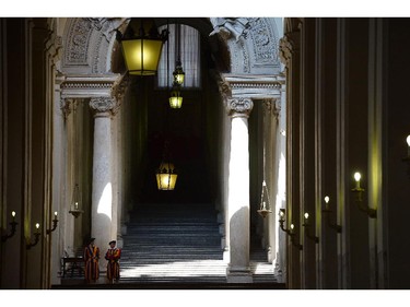 Swiss guards stand in a corridor prior a private audience on June 13, 2014 at the Vatican.