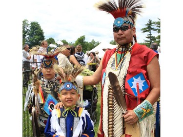 Vaughn, Kamiakin and Lee Hannigan at the Summer Soltice Aboriginal Festival at Vincent Massey Park on Saturday.