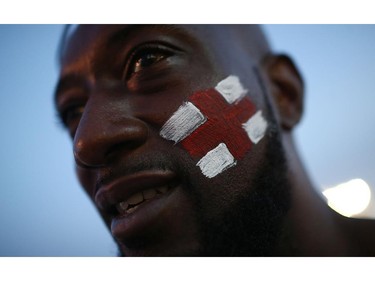 RIO DE JANEIRO, BRAZIL - JUNE 14: An England fan shows off his flag prior to their game against Italy at the FIFA Fan Fest on Copacabana Beach on June 14, 2014 in Rio de Janeiro, Brazil. The match was played on the third day of the World Cup tournament.