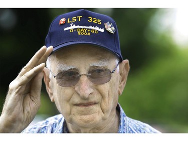 World War II veteran who was at Normandy on D-Day, Emil Kolar, participates in ceremonies to mark the 70th anniversary of the World War II D-Day invasion at Normandy, France, in front of the World War II Memorial at Oak Ridge Cemetery Friday, June 6, 2014, in Springfield, Ill.