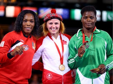 Gold medallist Erica Wiebe of Stittsville shares the podium with Annabel Ali of Cameroon, left, and Blessing Onyebuchi of Nigeria.