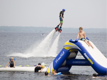 A man seems to float on air as he flyboards in Calabogie Lake during the Canadian Wake Surf Nationals Friday July 25, 2014.