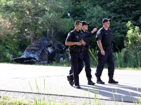 A young man is in hospital with life-threatening injuries after a single vehicle roll-over on Carling Avenue near Shirley's Bay in Ottawa, Saturday, July 12, 2014.