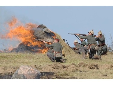 Actors dressed as German soldiers take part in the re-enactment of the 1914 Battle of Tannenberg in Szkotowo, Poland, Sunday, July 27, 2014, marking the 100th anniversary of the beginning of World War I. History enthusiasts from across Europe gathered to reconstruct the Battle of Tannenberg, an engagement between the Russian and German Empires in the first days of World War I.