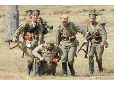 Actors dressed as Russian soldiers take part in the re-enactment of the 1914 Battle of Tannenberg in Szkotowo, Poland, Sunday, July 27, 2014, marking the 100th anniversary of the beginning of World War I. History enthusiasts from across Europe gathered   to reconstruct the Battle of Tannenberg, an engagement between the Russian and German Empires in the first days of World War I.