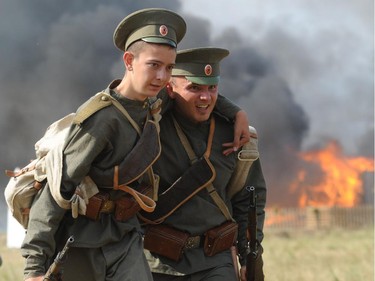 Actors dressed as Russian soldiers take part in the re-enactment of the 1914 Battle of Tannenberg in Szkotowo, Poland, Sunday, July 27, 2014, marking the 100th anniversary of the beginning of World War I. History enthusiasts from across Europe gathered to reconstruct the Battle of Tannenberg, an engagement between the Russian and German Empires in the first days of World War I.