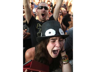 Alexa Rushton is in tears at the sight of Slash, featuring Myles Kennedy (vocals) and the Conspirators, performing on Friday night, July 11, 2014, at Bluesfest in LeBreton Flats.