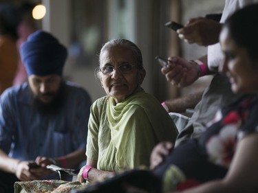 Amarjit Kaur enjoys some time with friends and Family during a picnic at Saunders Farm. Hundreds of people from the Ottawa indian community took part in the India Canada Association: Unity Picnic at Saunders Farm in Munster, July 27, 2014.